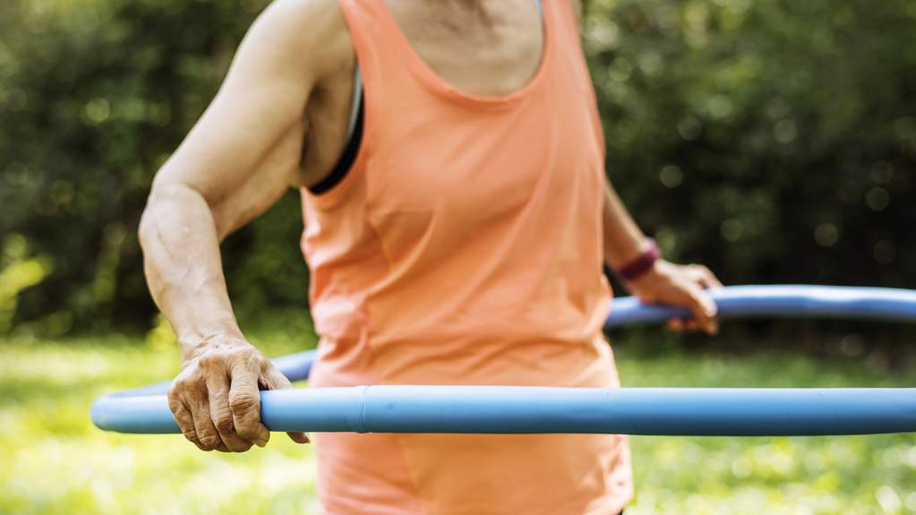 Senior woman exercising at an easy pace outdoors