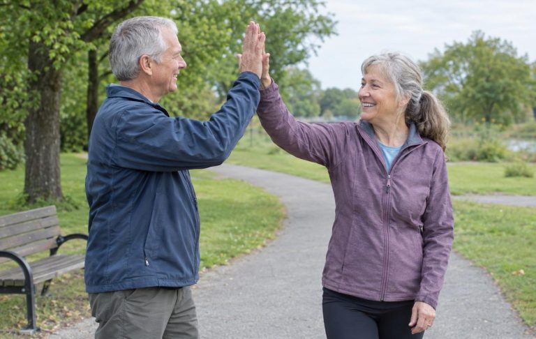 Two friends in their sixties meeting for their morning walk